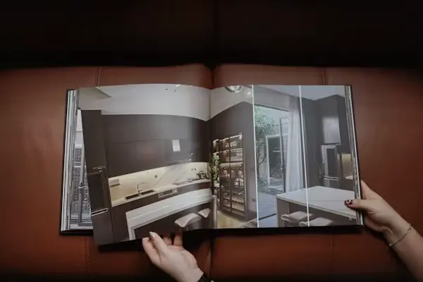 Designer working at workspace with blueprints
